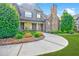 Charming home with brick facade, stone chimney, and lush landscaping at 468 Scott Farm Dr, Powder Springs, GA 30127