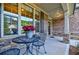 Charming front porch with bistro set and inviting decor at 468 Scott Farm Dr, Powder Springs, GA 30127