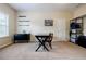 Bright home office with a dark desk, shelves, and a large window providing natural light at 468 Scott Farm Dr, Powder Springs, GA 30127