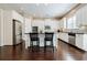 Spacious kitchen features white cabinets, stainless appliances, and hardwood flooring at 468 Scott Farm Dr, Powder Springs, GA 30127