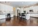 A kitchen showcasing white cabinets, stainless appliances, and black countertops at 468 Scott Farm Dr, Powder Springs, GA 30127