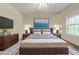 Beautifully staged bedroom with a comfortable bed, stylish furniture, and a bright window view at 468 Scott Farm Dr, Powder Springs, GA 30127