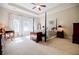 Bright bedroom with a four poster bed, tray ceilings and lots of natural light at 468 Scott Farm Dr, Powder Springs, GA 30127