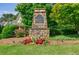 Stone entrance sign for Scott Farm surrounded by mature trees and landscaping at 468 Scott Farm Dr, Powder Springs, GA 30127