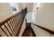 View down staircase featuring dark wood steps and a decorative wrought iron railing at 468 Scott Farm Dr, Powder Springs, GA 30127
