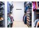 Walk-in closet featuring shelving and hanging storage, optimizing space and organization at 468 Scott Farm Dr, Powder Springs, GA 30127