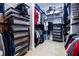 Organized walk-in closet with shelves, rods, and pull-out storage containers for optimal organization at 468 Scott Farm Dr, Powder Springs, GA 30127
