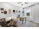 Bright home office featuring neutral walls, large windows, and comfortable seating with design package samples at 470 Village Ln, Fairburn, GA 30213