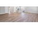 Spacious living room featuring wood-style floors, white walls, and ample natural light at 470 Village Ln, Fairburn, GA 30213