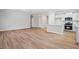 Inviting living space featuring hardwood floors, a modern kitchen, and open floor plan at 470 Village Ln, Fairburn, GA 30213