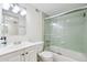 Bathroom featuring a vanity sink, a toilet, and a tub/shower with sliding glass doors at 620 Peachtree Ne St # 403, Atlanta, GA 30308