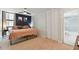 A spacious bedroom with a carpet, an open closet and next to an attached bathroom at 620 Peachtree Ne St # 403, Atlanta, GA 30308