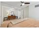 Comfortable bedroom with hardwood floors, dresser, and ceiling fan at 620 Peachtree Ne St # 403, Atlanta, GA 30308