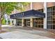 Elegant building entrance with a covered awning, showcasing the Windsor Over Peachtree address at 620 Peachtree Ne St # 403, Atlanta, GA 30308