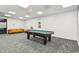 Spacious game room featuring a pool table and comfortable seating for entertainment at 620 Peachtree Ne St # 403, Atlanta, GA 30308
