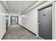 Hallway view of unit 403 with grey carpet and dark grey trim with white walls at 620 Peachtree Ne St # 403, Atlanta, GA 30308