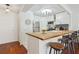 Bright, modern kitchen with white cabinetry, stainless steel appliances, and a breakfast bar at 620 Peachtree Ne St # 403, Atlanta, GA 30308