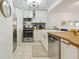 Modern kitchen featuring stainless steel appliances, tile backsplash, and a farmhouse sink at 620 Peachtree Ne St # 403, Atlanta, GA 30308