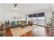 Stylish living room with hardwood floors, a comfortable sofa, and access to a balcony at 620 Peachtree Ne St # 403, Atlanta, GA 30308