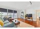 Cozy living room with large windows, wood floors, and a comfortable seating area at 620 Peachtree Ne St # 403, Atlanta, GA 30308