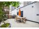 Patio featuring an outdoor dining set, a grill, and string lights at 620 Peachtree Ne St # 403, Atlanta, GA 30308