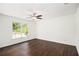 Bedroom with hardwood floors, a window, and a ceiling fan at 1198 Larson Sw Ln, Marietta, GA 30064
