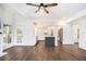 Spacious living room with an open design, hardwood floors, and seamless access to the adjacent kitchen at 1198 Larson Sw Ln, Marietta, GA 30064