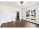 Inviting living room with French doors, bright windows, and hardwood floors, creating a welcoming ambiance at 1198 Larson Sw Ln, Marietta, GA 30064