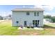 Well-maintained backyard with a patio area, seating, and grill for outdoor entertaining at 20 Tarpley Way, Covington, GA 30016