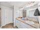 Bright bathroom featuring double sinks, granite countertops, and a separate tub and shower at 20 Tarpley Way, Covington, GA 30016