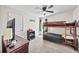 Shared bedroom with bunk beds, a ceiling fan, and a window for natural light at 20 Tarpley Way, Covington, GA 30016