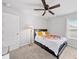 Inviting bedroom featuring a comfortable bed, neutral decor, and ample natural light at 20 Tarpley Way, Covington, GA 30016