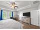 The main bedroom is spacious and bright with tray ceilings and large windows at 20 Tarpley Way, Covington, GA 30016