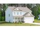 Well-maintained home exterior with green lawn, white trim, and a covered front porch at 20 Tarpley Way, Covington, GA 30016