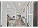Bright and airy hallway with wood-look floors, leading to various rooms in the home at 20 Tarpley Way, Covington, GA 30016