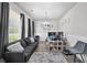Cozy living room with ample seating, neutral decor, and plenty of natural light at 20 Tarpley Way, Covington, GA 30016