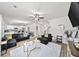 Open concept living space with modern furnishings, hardwood floors, and plenty of space for entertaining at 20 Tarpley Way, Covington, GA 30016