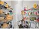 Walk-in pantry with ample shelving providing plenty of storage space at 20 Tarpley Way, Covington, GA 30016