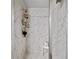 Walk-in shower featuring beautiful marble tiling, providing a spa-like experience at 20 Tarpley Way, Covington, GA 30016