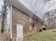 Rear brick exterior featuring the backyard, and a small patio area at 2550 Stoney Brook Ne Ln, Marietta, GA 30062