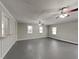 Basement with painted floor and lots of ceiling fans at 2550 Stoney Brook Ne Ln, Marietta, GA 30062