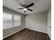 Bedroom featuring hardwood floors, natural lighting, and a ceiling fan at 2550 Stoney Brook Ne Ln, Marietta, GA 30062