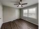 Bright bedroom featuring hardwood floors, a ceiling fan, and natural lighting at 2550 Stoney Brook Ne Ln, Marietta, GA 30062