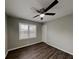 Bedroom featuring hardwood floors, a ceiling fan, and natural lighting at 2550 Stoney Brook Ne Ln, Marietta, GA 30062