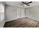 This bedroom features hard wood floors, natural lighting, and neutral-painted walls at 2550 Stoney Brook Ne Ln, Marietta, GA 30062