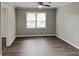 Bright bedroom with modern ceiling fan and new wood-look flooring at 2550 Stoney Brook Ne Ln, Marietta, GA 30062