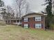 Charming brick two-story home featuring a landscaped yard and inviting front porch at 2550 Stoney Brook Ne Ln, Marietta, GA 30062
