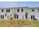 Beautiful backyard featuring a lush lawn and newly planted trees offering privacy at 305 Heavenly Hollow Pl, Mcdonough, GA 30253