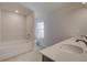 Bathroom featuring tub, toilet, window, and vanity with white countertop and sink at 305 Heavenly Hollow Pl, Mcdonough, GA 30253
