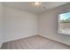 Bedroom featuring neutral walls and carpet with a window and closet at 305 Heavenly Hollow Pl, Mcdonough, GA 30253